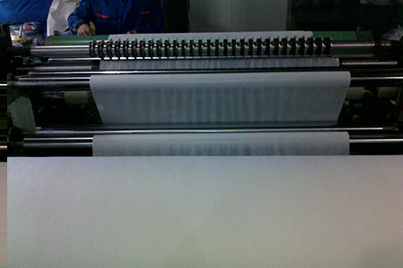 The shaped fibre mesh passes through the calendar and make the fibre web bond and finalize the design.
